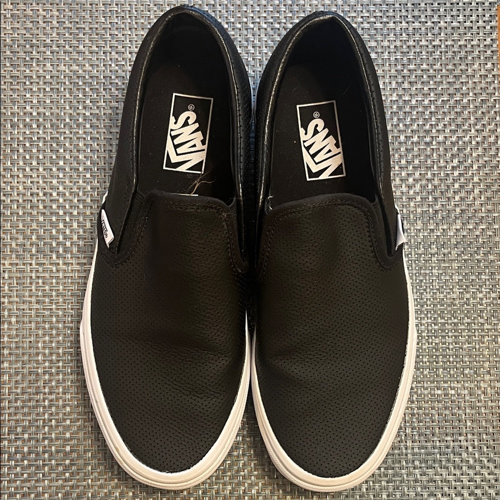 Vans women’s Black Perforated Slip-On Sneakers